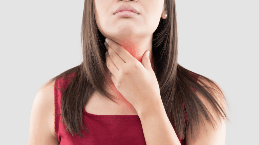 Person holding neck with visible inflammation area, representing inflammatory pain commonly studied in turmeric research