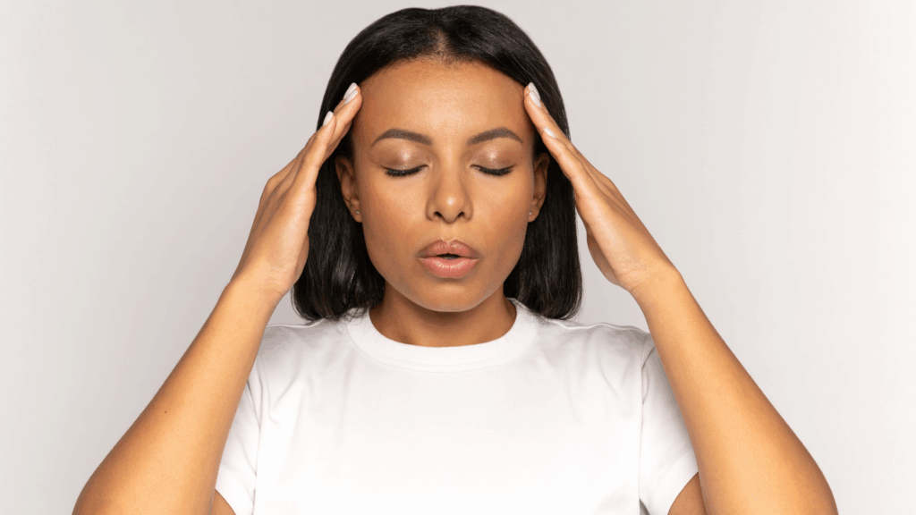 Person practicing calm breathing and focus to illustrate stress hormone regulation and mental balance associated with ashwagandha research