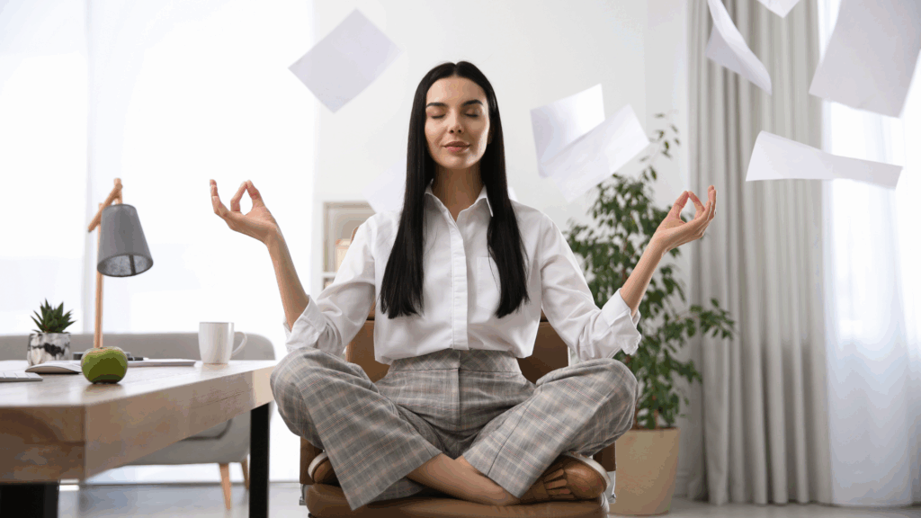 Person practicing mindfulness meditation at a desk to illustrate stress reduction and mental balance supported by ashwagandha research