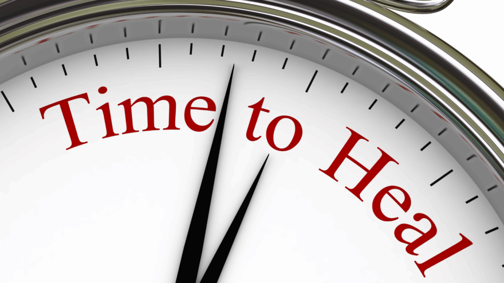 Close-up of a clock face with the words time to heal symbolizing recovery, balance, and long-term wellness support in plant-based health education